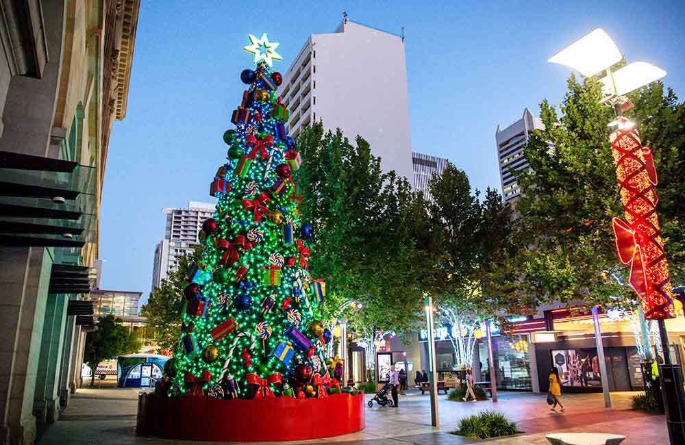 street christmas event with huge christmas tree decoration