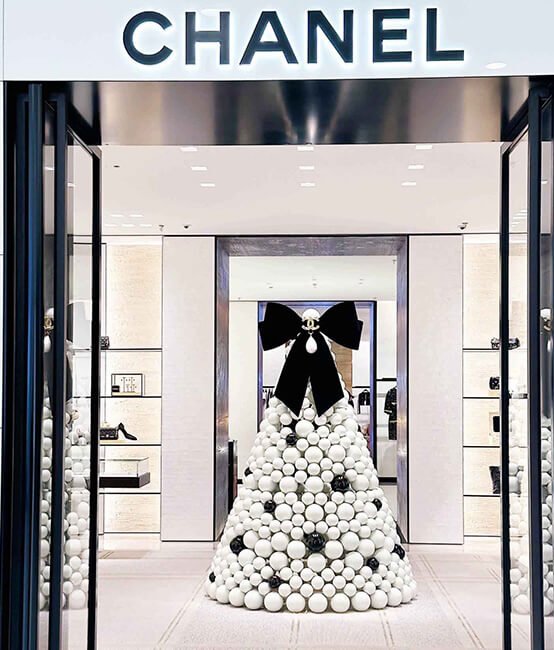 Chanel store interior design with Christmas tree decorated balls
