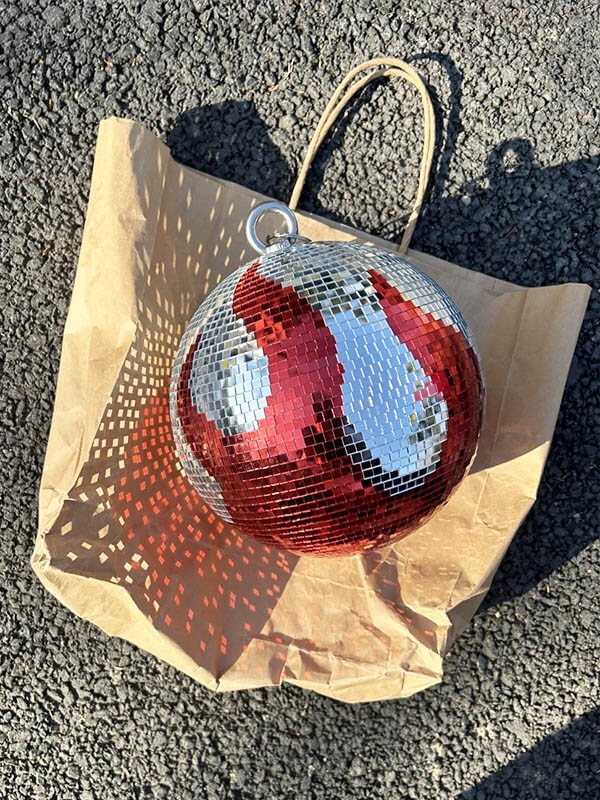 Custom disco ball painted design as display props for store window