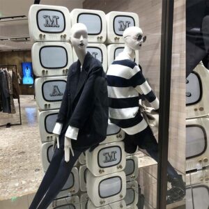MaxMara store window display with custom wooden TV props