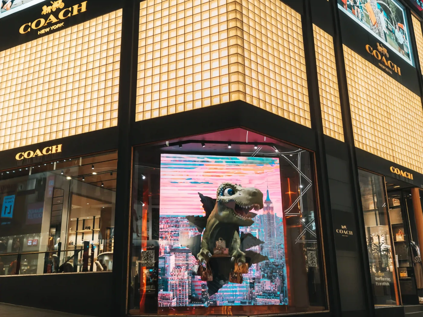 fiberglass dragon emerging from LED screen for Coach window display scaled