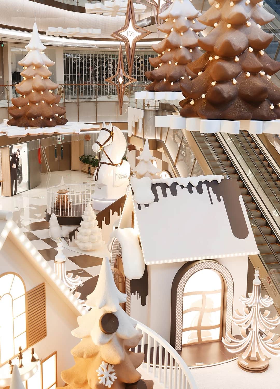 Luxury Christmas window display scheme installed across a flagship storefront