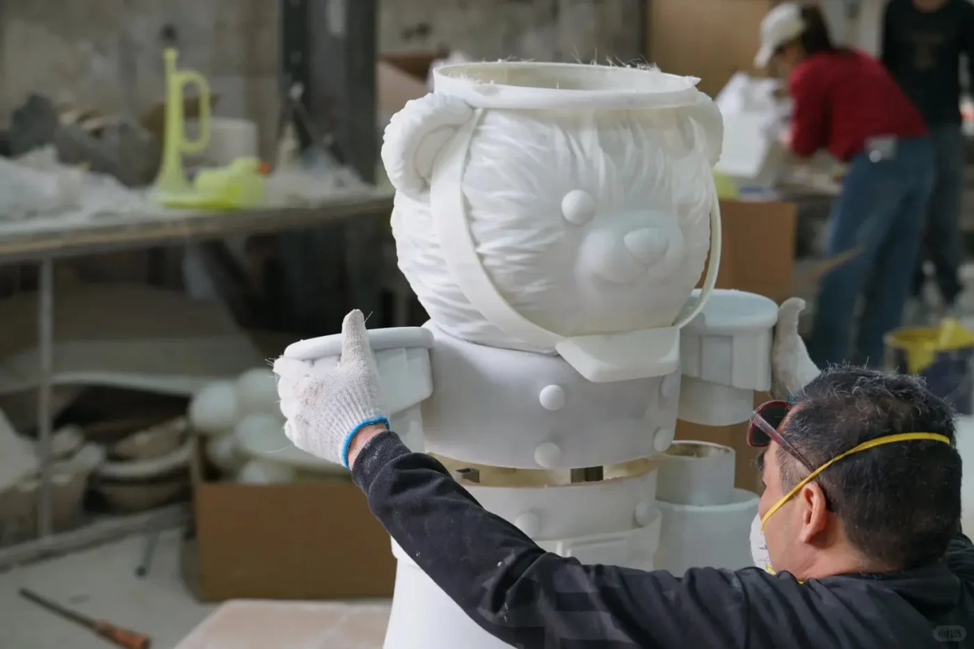 the production process of fiberglass bear shaped sculptures