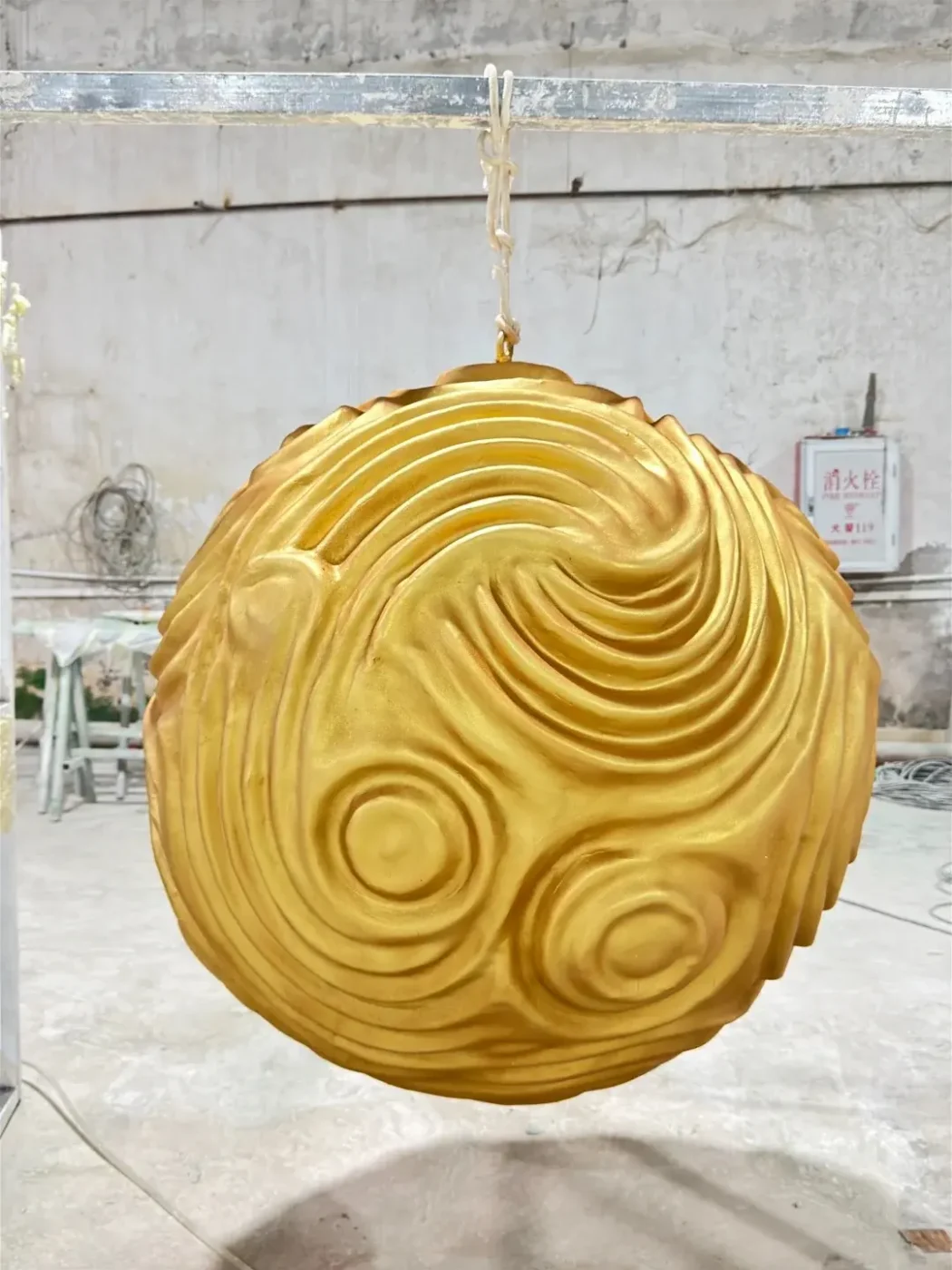 gold electroplated fiberglass round hanging sculpture