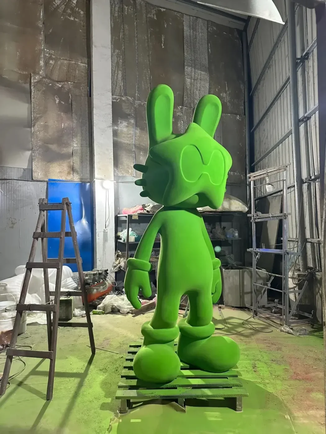green painted fiberglass cartoon sculpture
