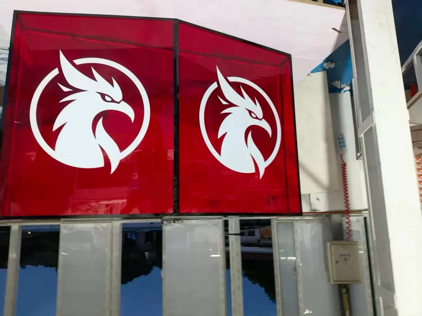 red acrylic hanging lightbox sign installation