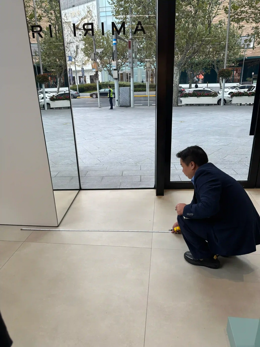 production team checking dimensions of a retail window display prototype (1)