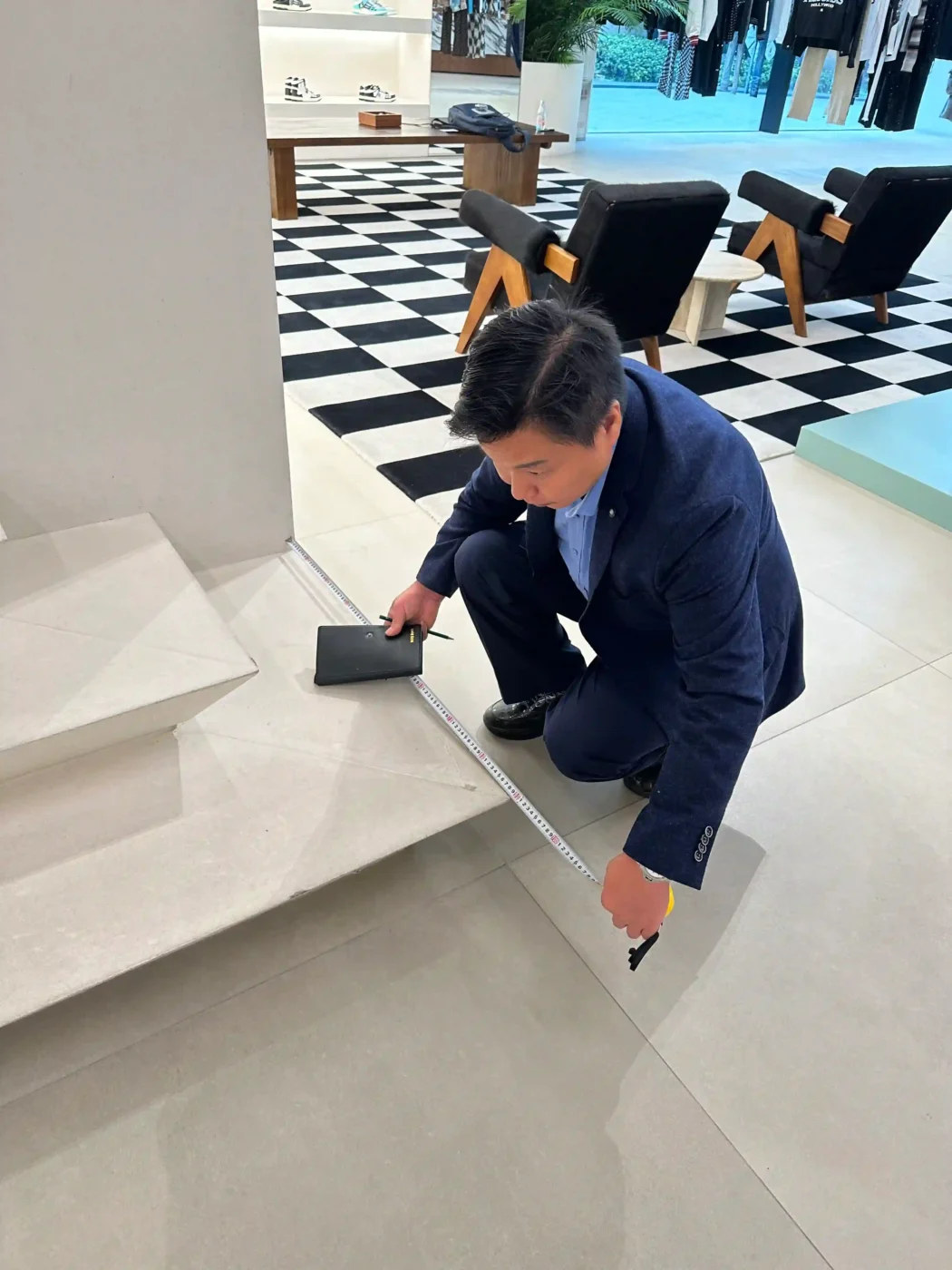 production team checking dimensions of a retail window display prototype (2)